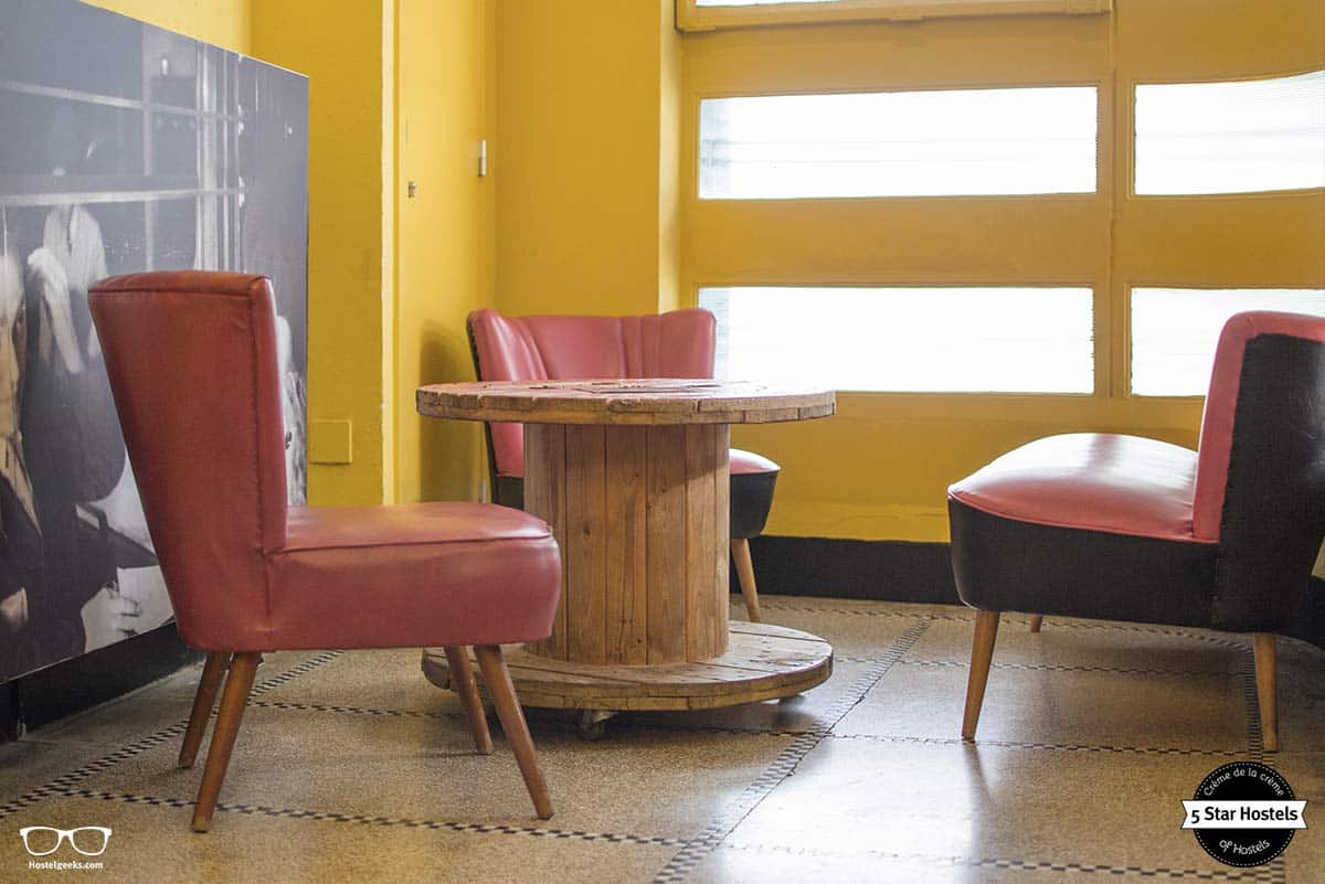 Upcycled tables in the living room at Backstay Hostel in Ghent