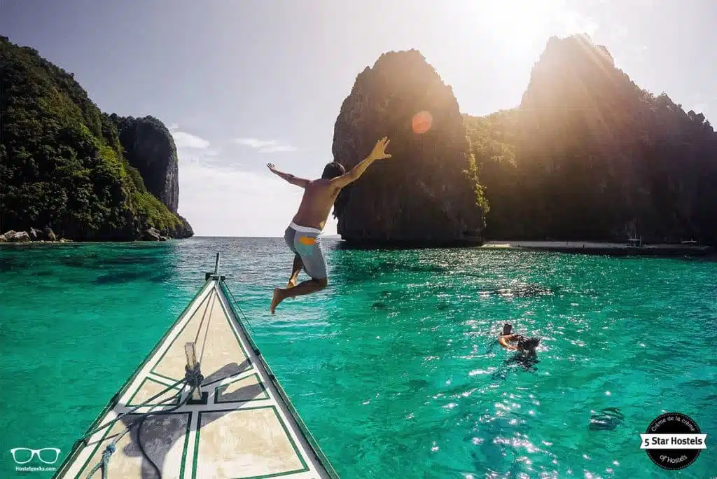 Jump in the blue water of Palawan