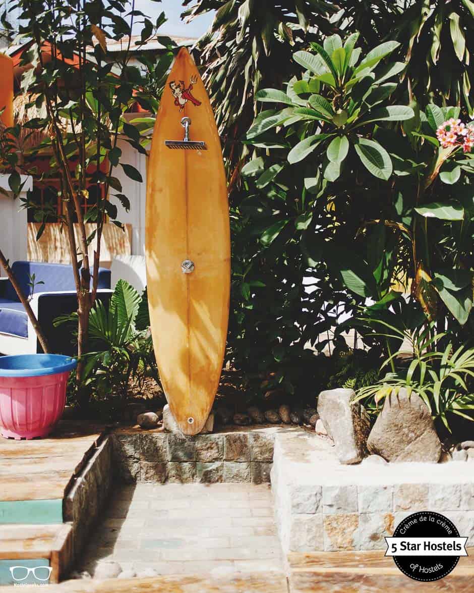 That surfboard? It's the shower next to the pool. That is so cool!