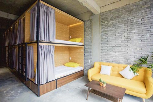 Super cool dorm with stylish bunk beds at The VIetnam Hostel, one of the Da Nang Hostels