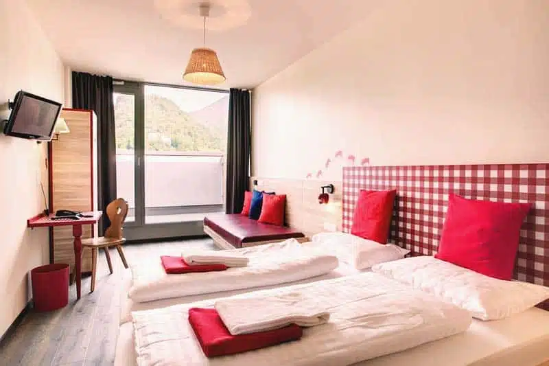 Rooms are lighted with big glass windows at Meininger Salzburg