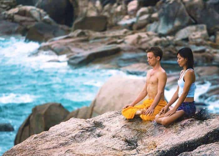 Couples pratising yoga at Vikasa Yoga Retreat