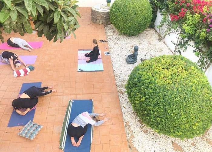 Yoga practice at the garden of Villa Agus